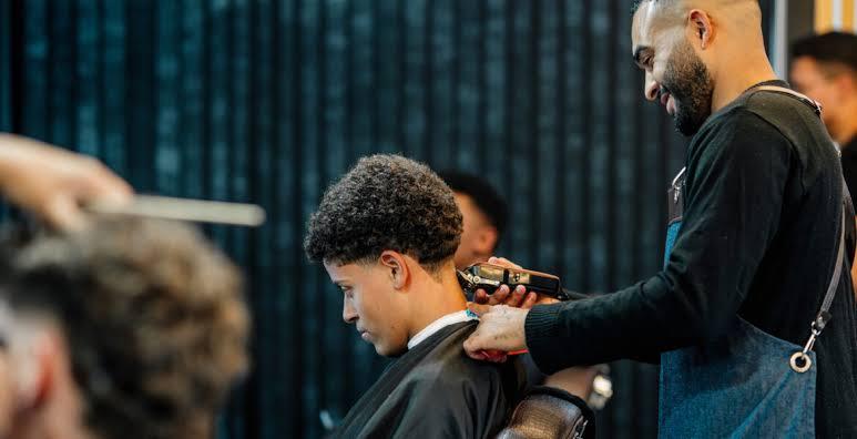 Barber giving a client a fresh fade