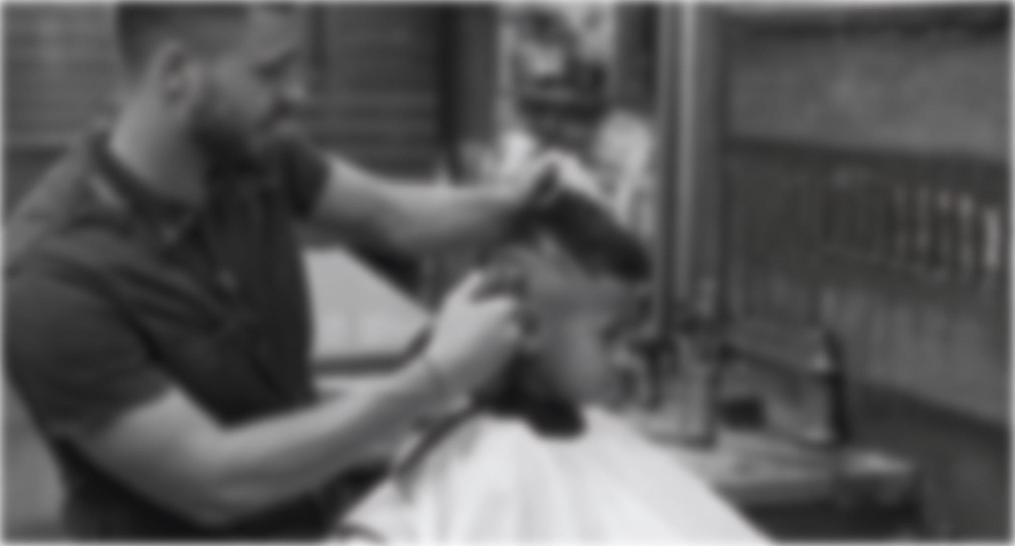 Barber cutting a client's hair